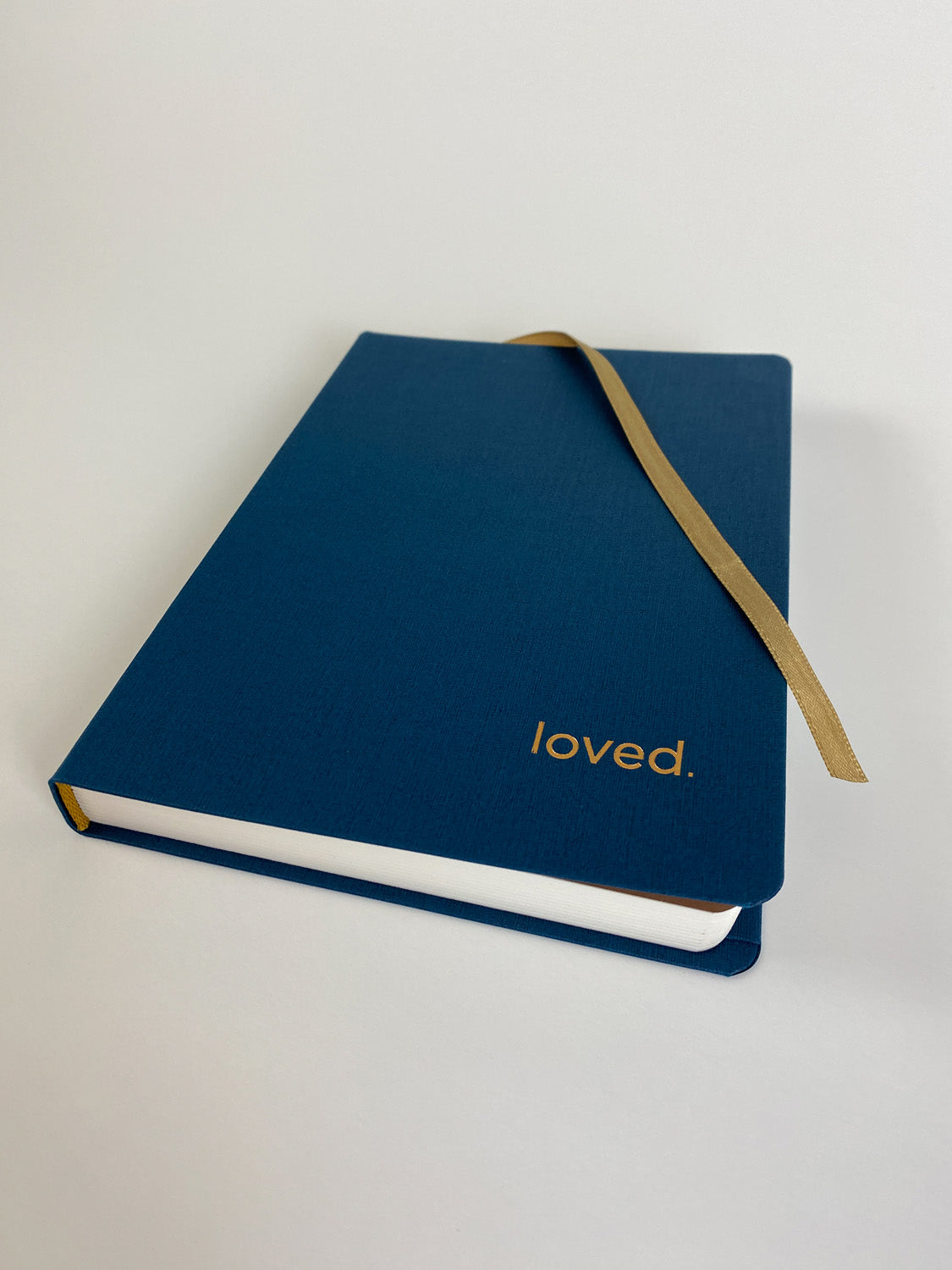 Matching copper ribbon to keep your place in the journal.