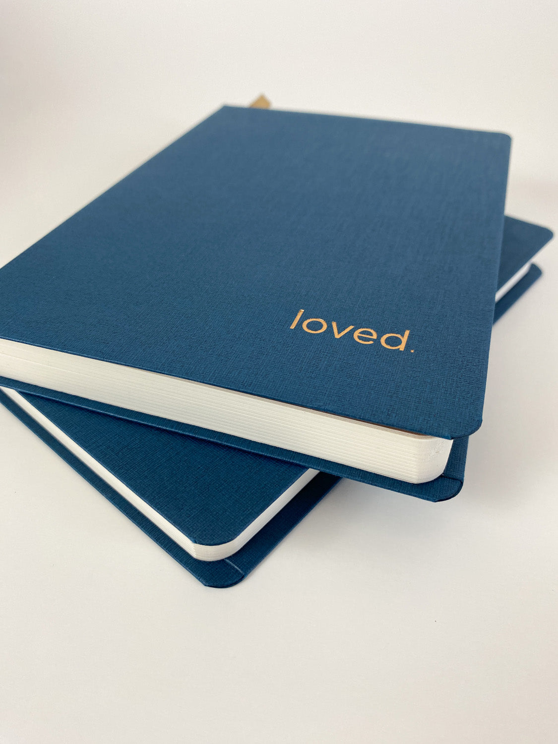 Textured cover, rounded edges, and stamped copper foil print on the cover make this keepsake journal feel elevated.